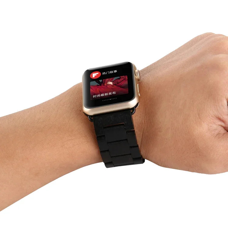 Wooden wrist strap for Apple Watch displayed on wrist, showcasing its stylish design and compatibility with various models.