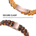 oval resin replacement strap for Apple Watch showing secure clasp and double button folding design.