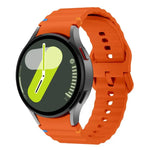 Kalebol Wave Stitching Silicone Watch Band for Samsung Galaxy Watch models, featuring a vibrant orange design.
