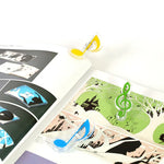 10 Stück Buchclips in Form von Musiknoten aus PP-Material und Edelstahl mit Feder, Deluxe-Seitenhalter, zufällige Farbauswahl