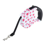 5 m lange, einziehbare Hundeleine mit rosa Hundepfotenabdruckmuster, einfache Bedienung, rosa Hundepfotenabdruck