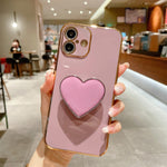 Galvanisierte Liebesherz-Halterung TPU Handyhülle, Für iPhone 17e / 16e, Für iPhone 17 Pro Max, Für iPhone 17 Pro, Für iPhone 17, Für iPhone Air, Für iPhone 16 Pro Max, Für iPhone 16 Pro, Für iPhone 16 Plus