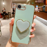 Galvanisierte Liebesherz-Halterung TPU Handyhülle, Für iPhone 17e / 16e, Für iPhone 17 Pro Max, Für iPhone 17 Pro, Für iPhone 17, Für iPhone Air, Für iPhone 16 Pro Max, Für iPhone 16 Pro, Für iPhone 16 Plus