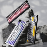 Ajazz AK650 Tri-Mode Kabellose Mechanische Tastatur mit Bildschirm, Knopf und RGB-Beleuchtung, Flying Fish Switch Lila Weiß Blau, Dream Switch Lila Weiß Blau, Dream Switch Schwarz Grau Gelb, Dream Switch Seitenbeschriftung Gradient Blackberry